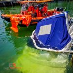 Marine salvage of boat sunk at dock.